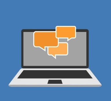 Scaled-down image of an open laptop. Orange speech bubbles can be seen on its screen.